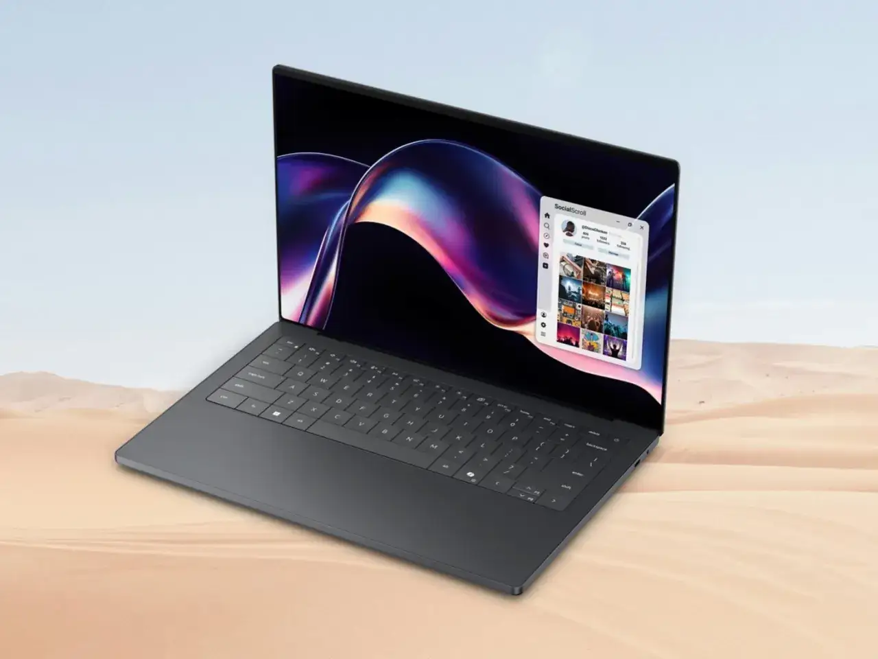 Ciemnoszary laptop z kolorową tapetą i oknem aplikacji społecznościowej. Idealny do pracy zdalnej, gdy liczy się czas pracy baterii.