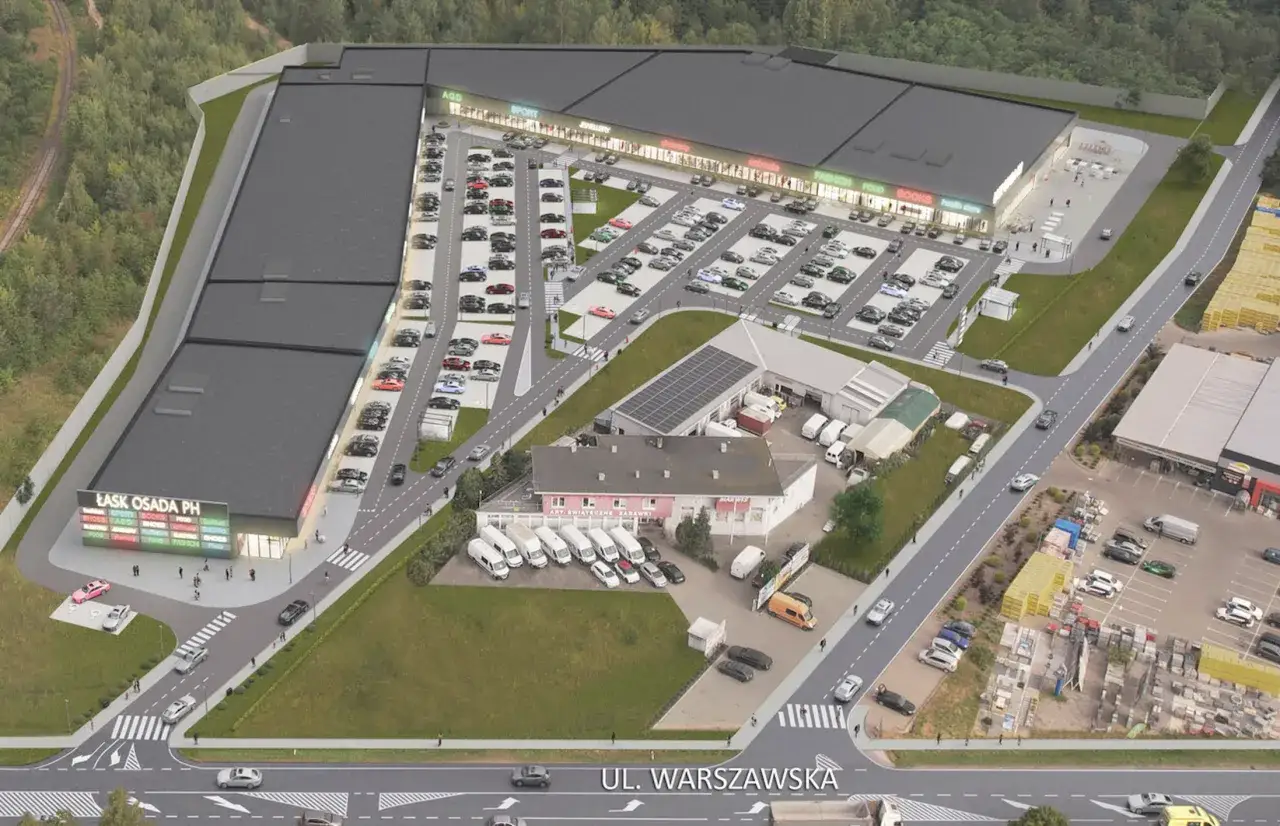 Park handlowy z parkingiem, pokazujący przyczyny upadku dużych galerii handlowych na rzecz parków handlowych.